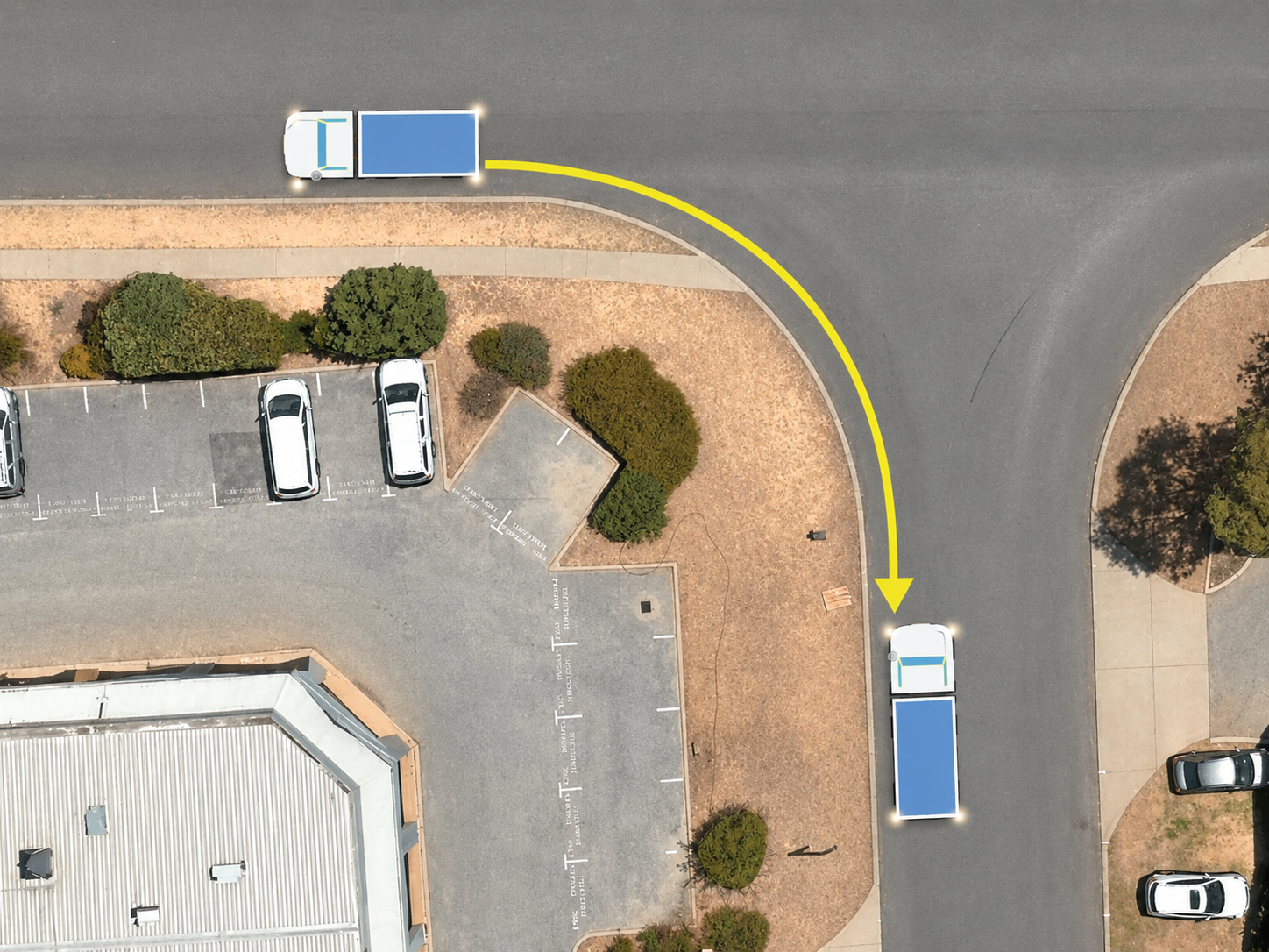 Overhead diagram showing a heavy rigid truck reversing around a left-hand corner from the start position to the end position