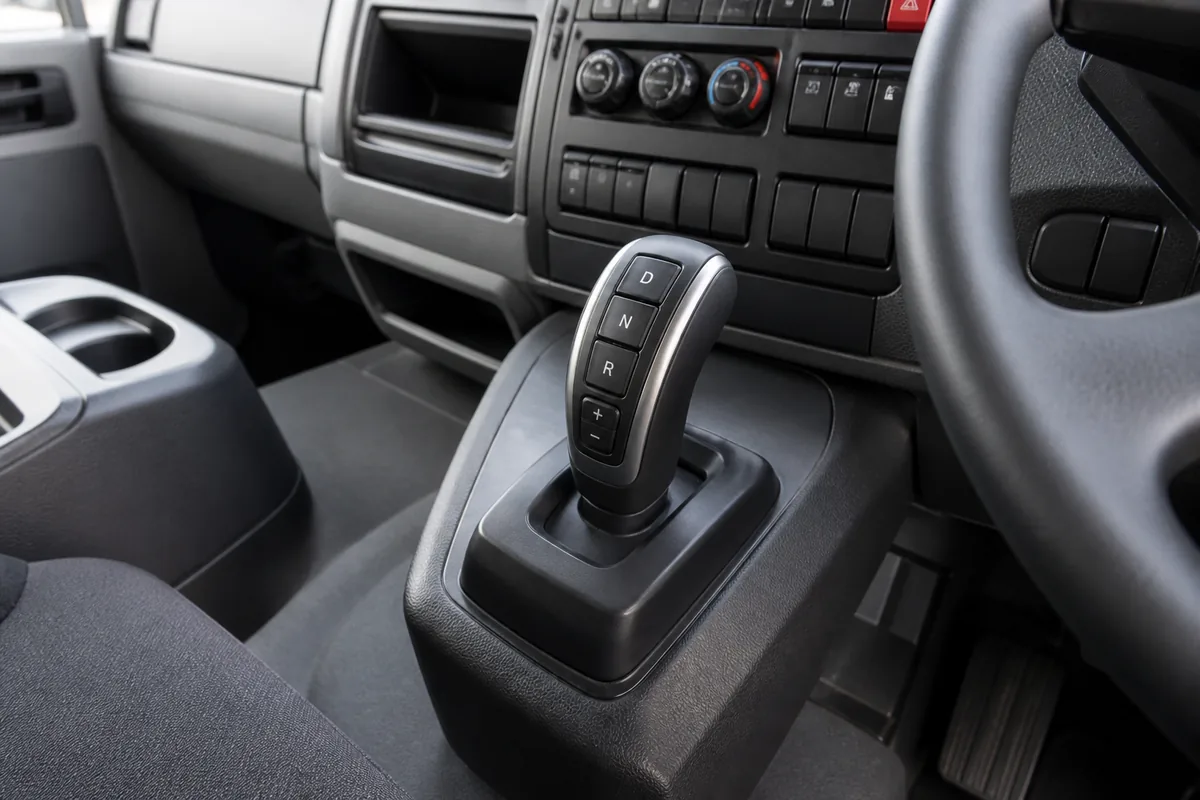 Automatic or AMT transmission selector inside a modern right-hand-drive heavy truck cab